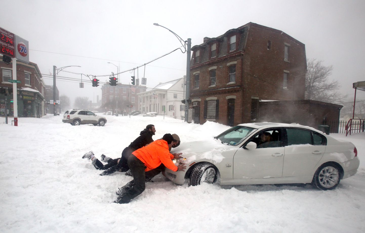 Mar 14, 2017; Beacon, NY, USA; Joelle Price of Poughkeepsie gets help after her car got stuck in snow on Main St. in Beacon, N.Y. during Winter Storm Stella. The late winter storm was expected to drop up to two feet of snow on the region throughout the day.  Mandatory Credit: Seth Harrison/The Poughkeepsie Journal via USA TODAY NETWORK *** Please Use Credit from Credit Field ***