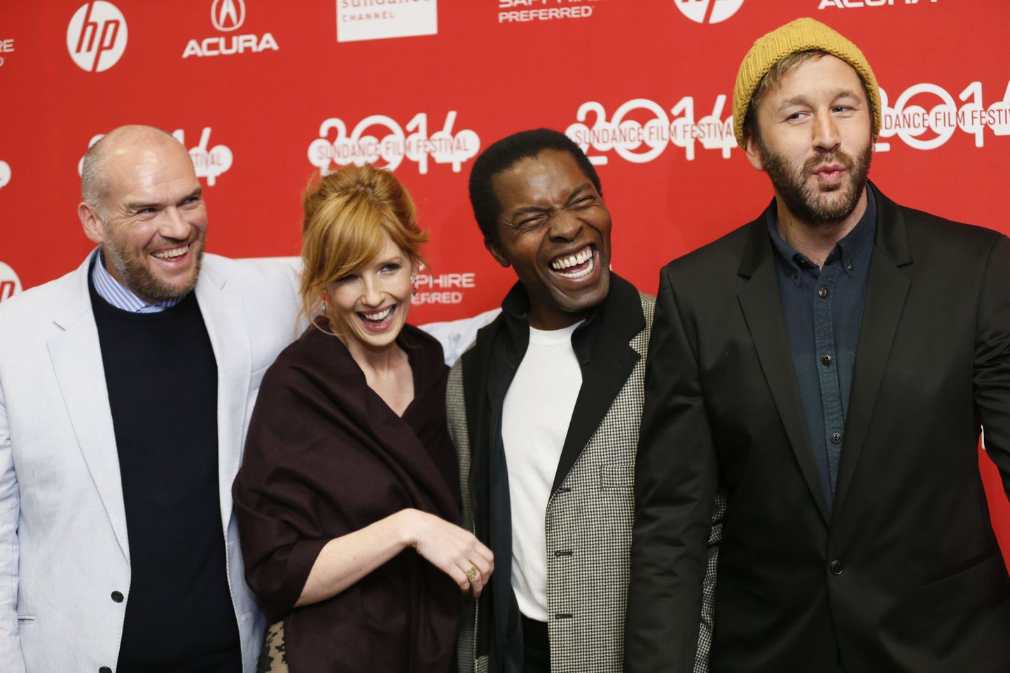From left to right, writer and director John Michael McDonagh and cast members Kelly Reilly, Isaach De Bankole, and Chris O'Dowd laugh together as they pose at the premiere of the film "Calvary" during the 2014 Sundance Film Festival, on Sunday, Jan. 19, 2014 in Park City, Utah. (Photo by Danny Moloshok/Invision/AP) / TT / kod 436