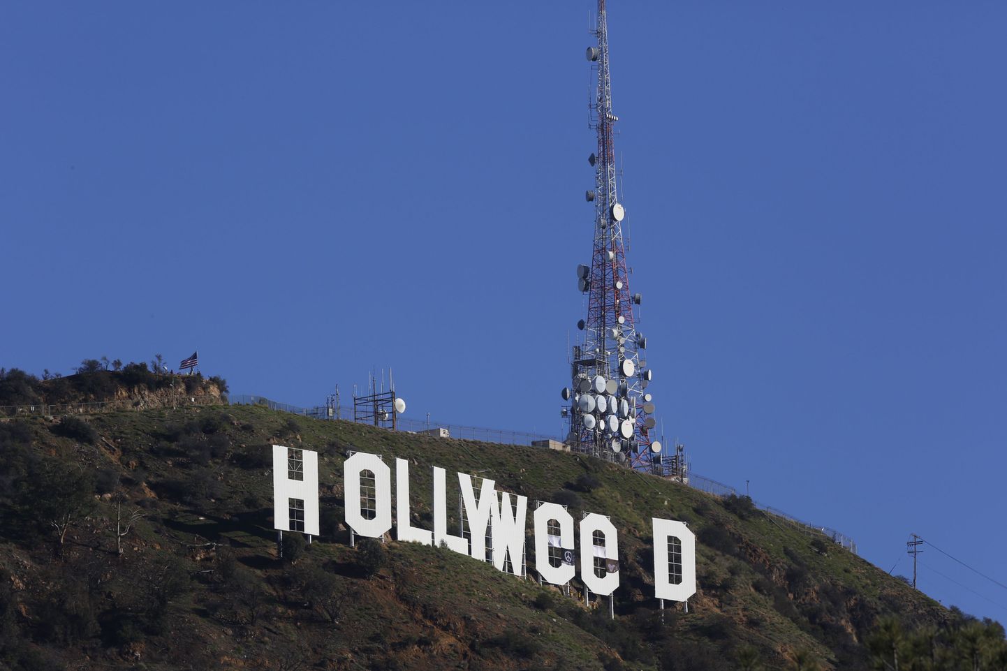 The Hollywood sign is seen vandalized Sunday, Jan. 1, 2017. Los Angeles residents awoke New Year's Day to find a prankster had altered the famed Hollywood sign to read "HOLLYWeeD."