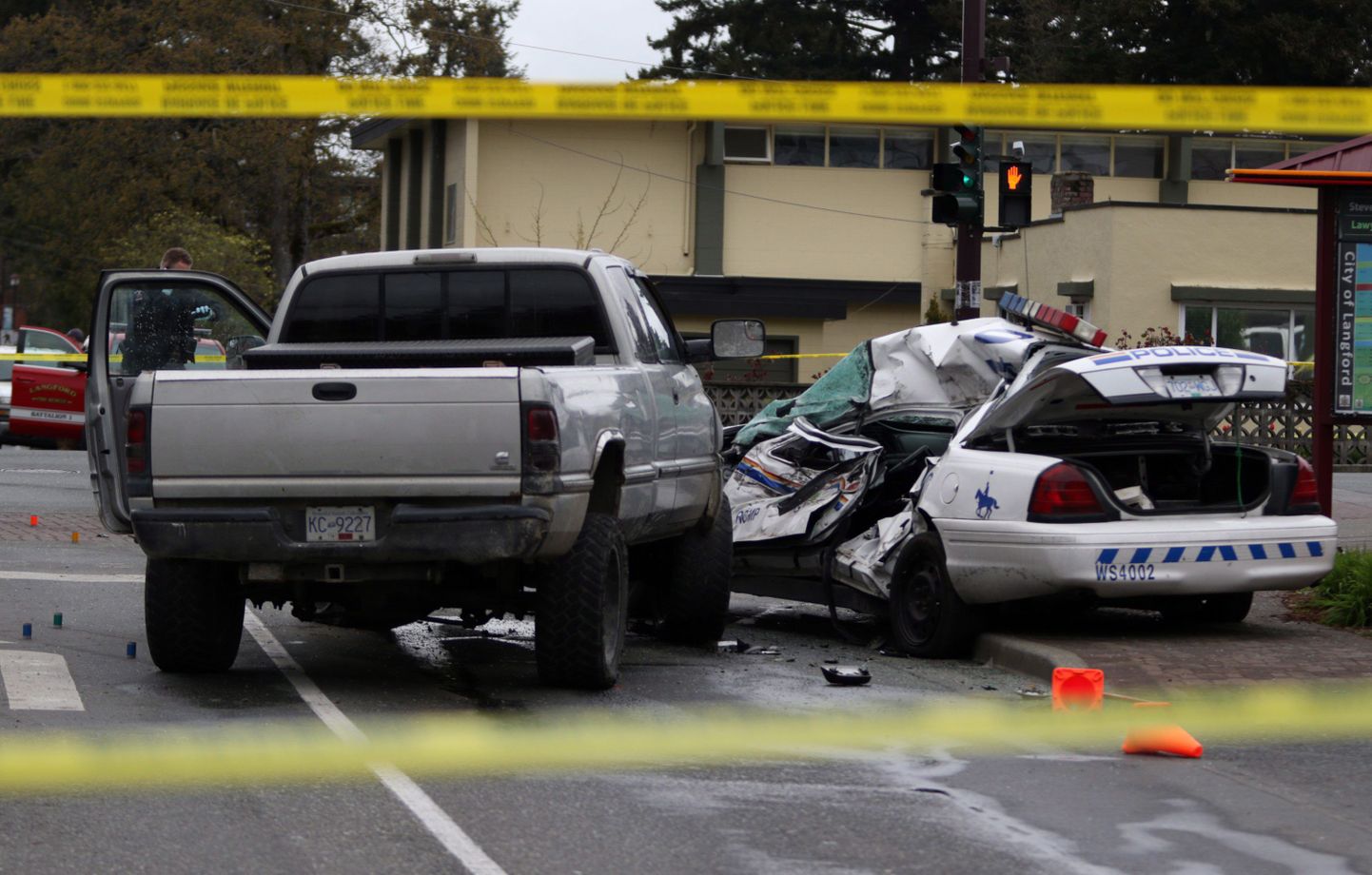 Police tape marks off the scene of the crash involving a police car and a pickup truck in Langford, B.C., Tuesday, April 5, 2016. RCMP Const. Sarah Beckett was killed in the crash. THE CANADIAN PRESS/Chad Hipolito