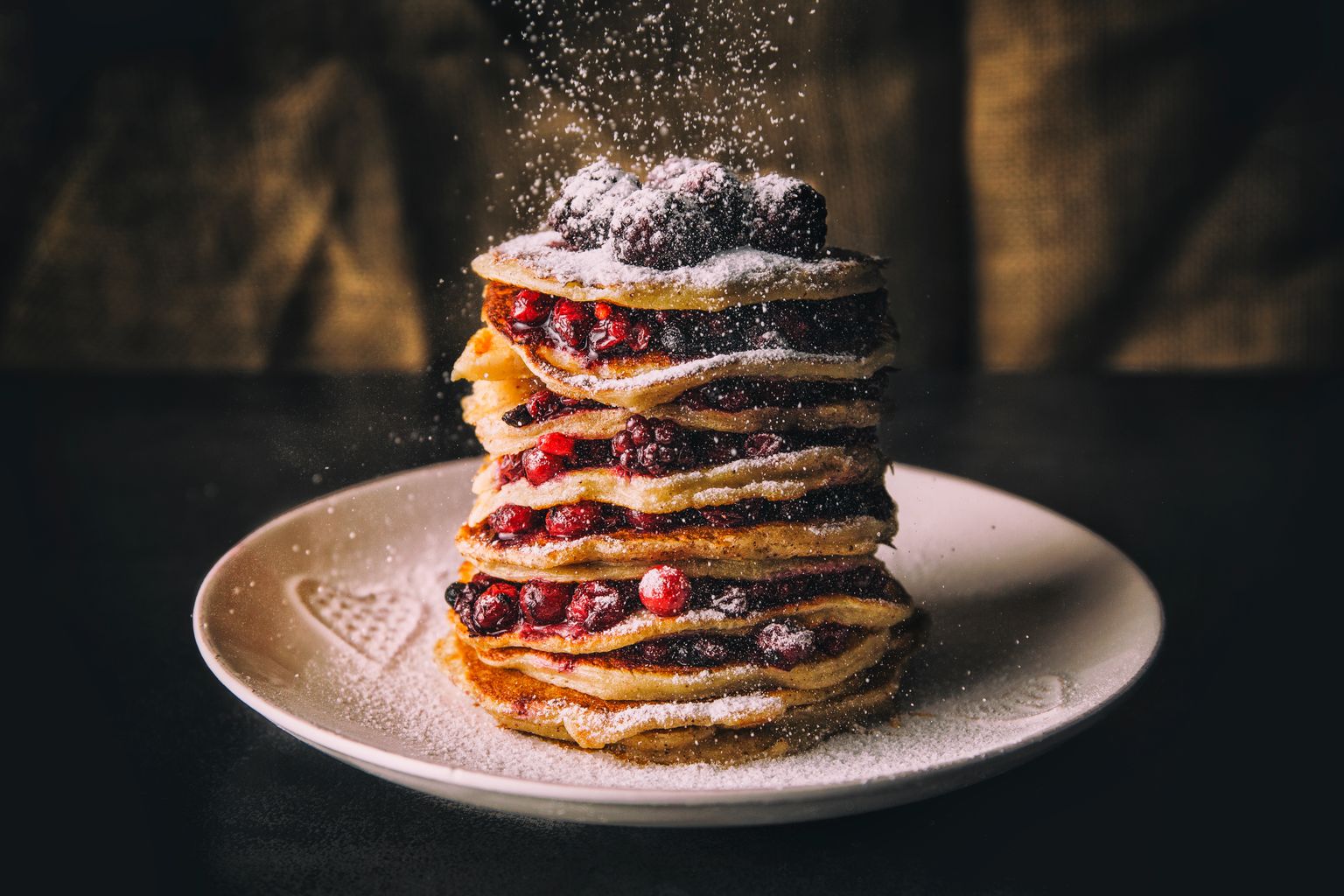 Pancakes with berries and sugar