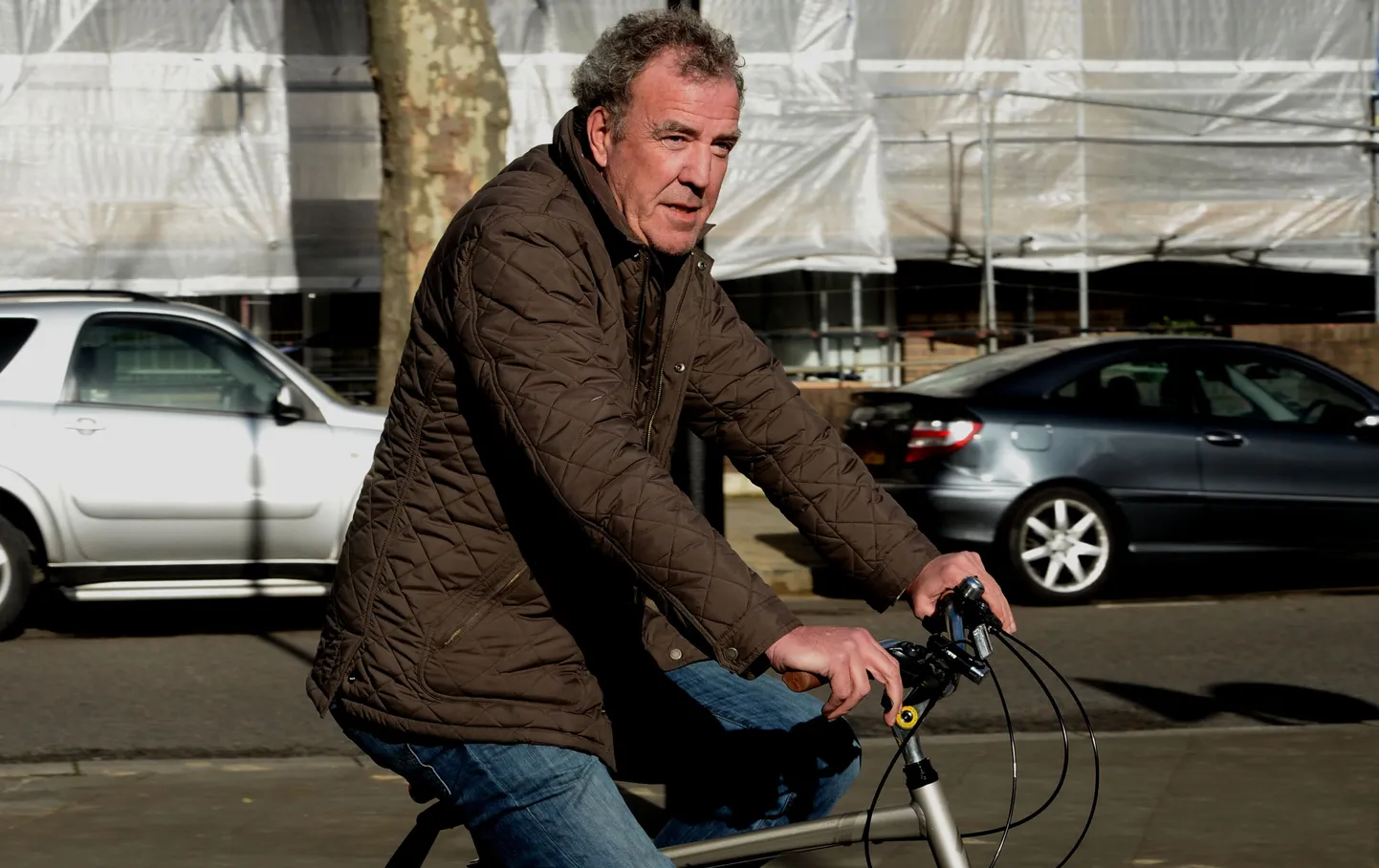 Jeremy Clarkson arrives at his home in west London, on a bicycle, as Clarkson's BBC career is over after an internal investigation found he launched an &quot;unprovoked physical and verbal attack&quot; which left one of the colleagues in hospital.