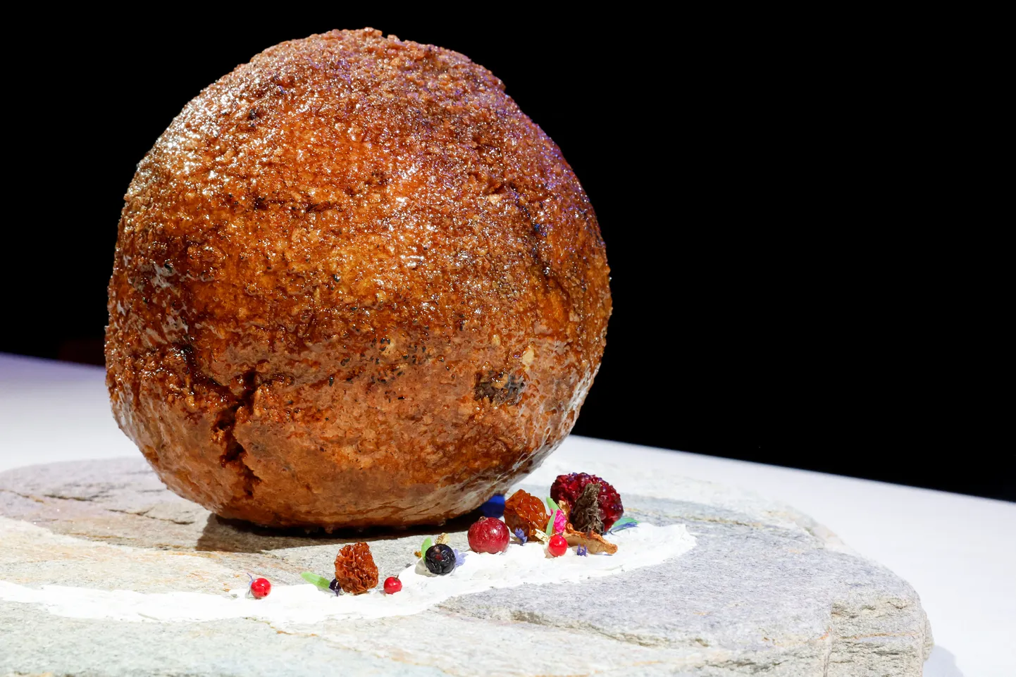 A meatball made from flesh cultivated using the DNA of an extinct woolly mammoth is presented at NEMO Science Museum created by a cultured meat company, in Amsterdam, Netherlands March 28, 2023. REUTERS/Piroschka van de Wouw