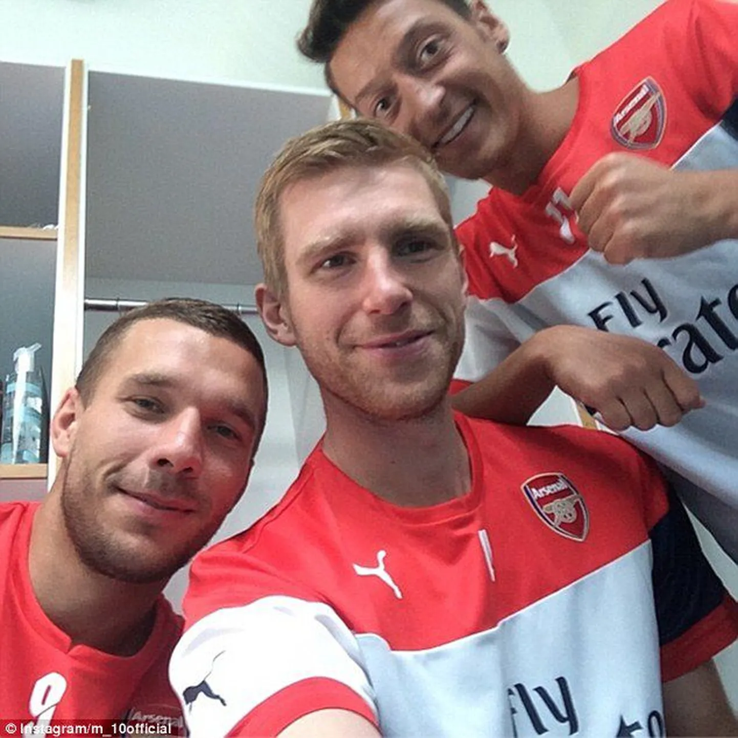 Lukas Podolski, Per Mertesacker ja Mesut Özil.