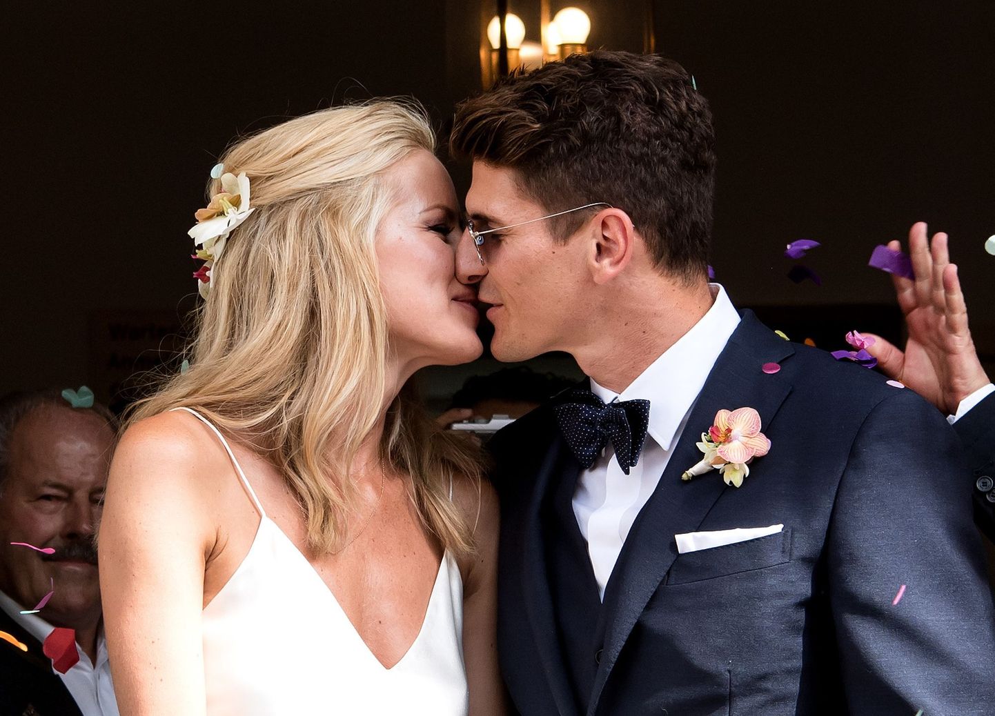 German soccer player Mario Gomez and his wife Carina kiss after their civil marriage at the registry office Schwabing in Munich, Germany, Friday, 22 July, 2016. (Sven Hoppe/dpa via AP)