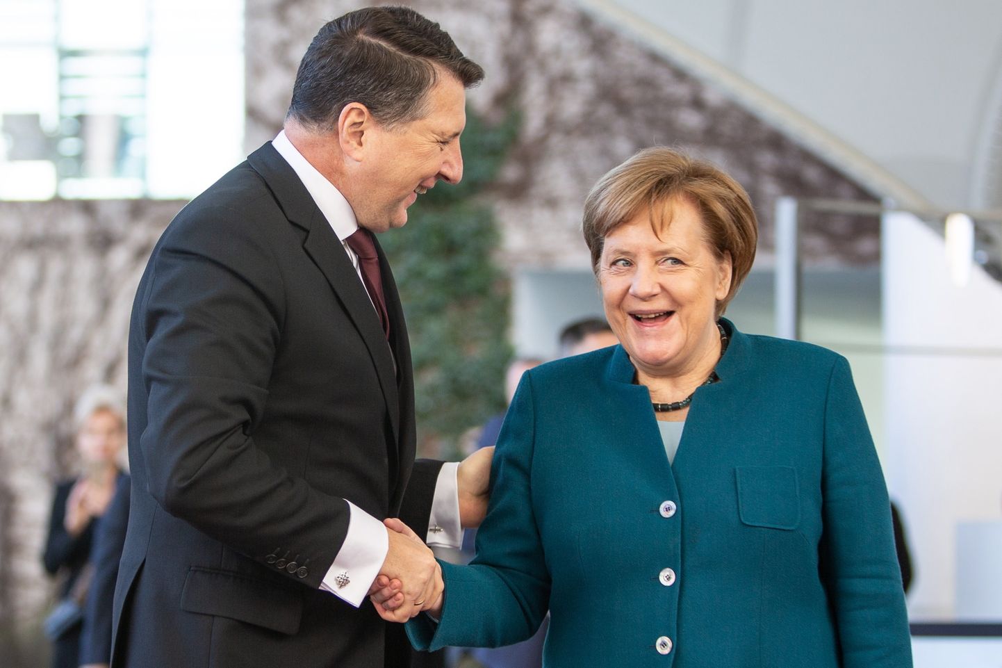 Raimonds Vējonis un Angela Merkele