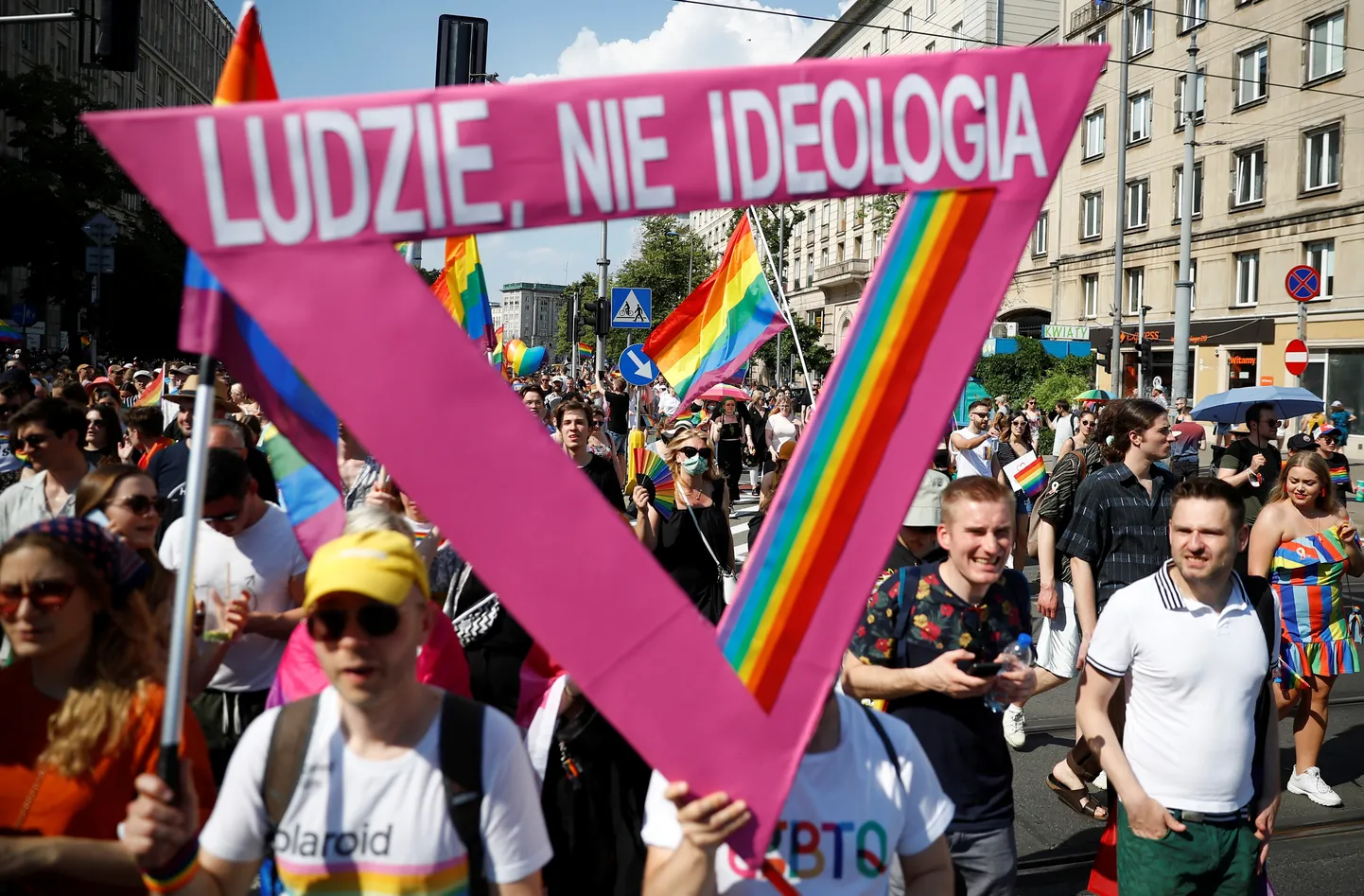 People attend the "Equality Parade" rally in support of the LGBT community, in Warsaw, Poland June 19, 2021. The writing reads: "People, not ideology". REUTERS/Kacper Pempel