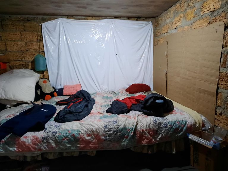 The Albeshenko family living in the basement of a garage in Mykolaiv has spent eight months in a row with their two daughters in modest conditions.