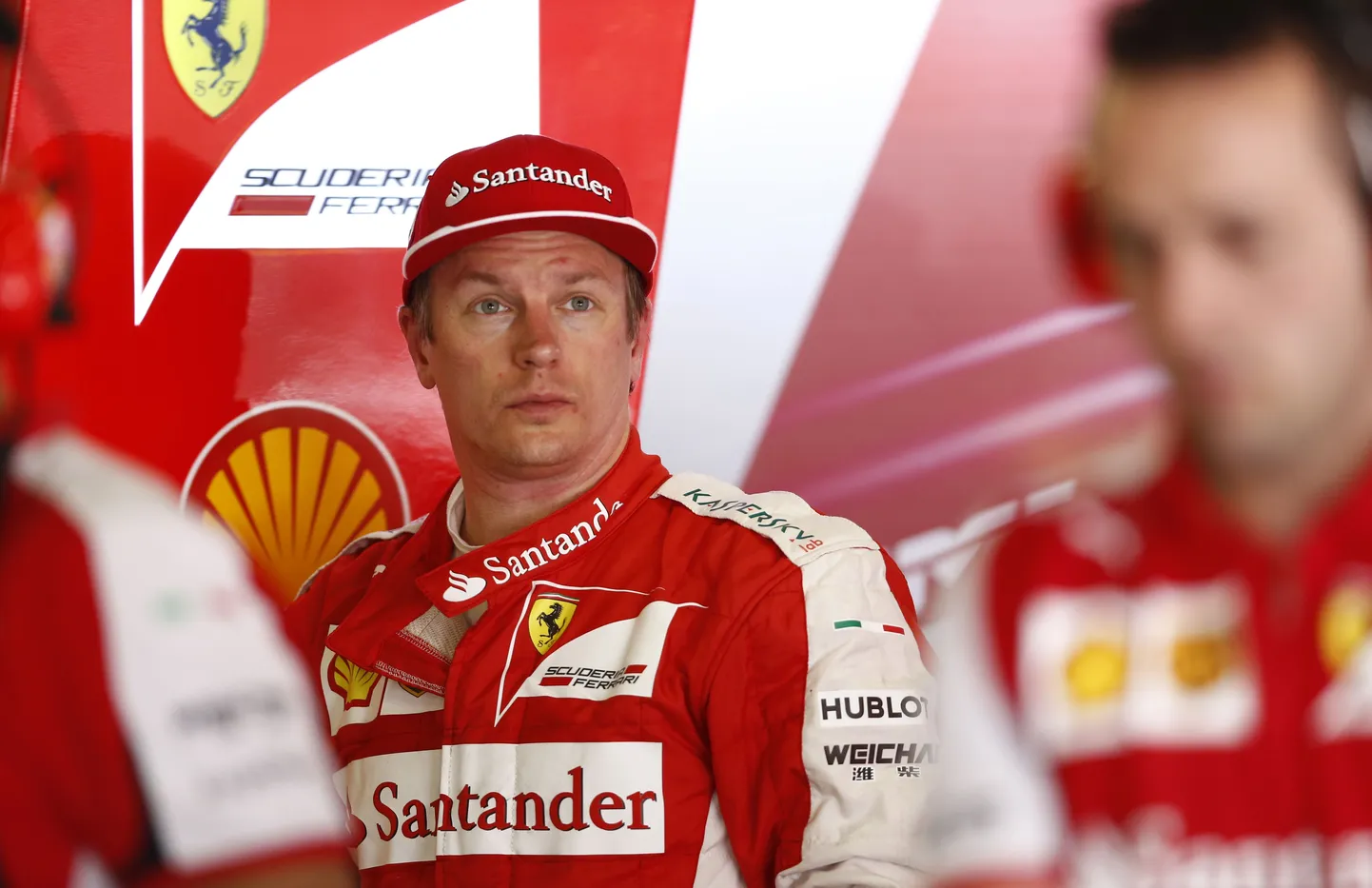Ferrari driver Kimi Raikkonen of Finland stands inside his box at the end of the second session for the Spain Formula One Grand Prix at the Barcelona Catalunya racetrack in Montmelo, just outside Barcelona, Spain, Friday, May 8, 2015. (AP Photo/Manu Fernandez)