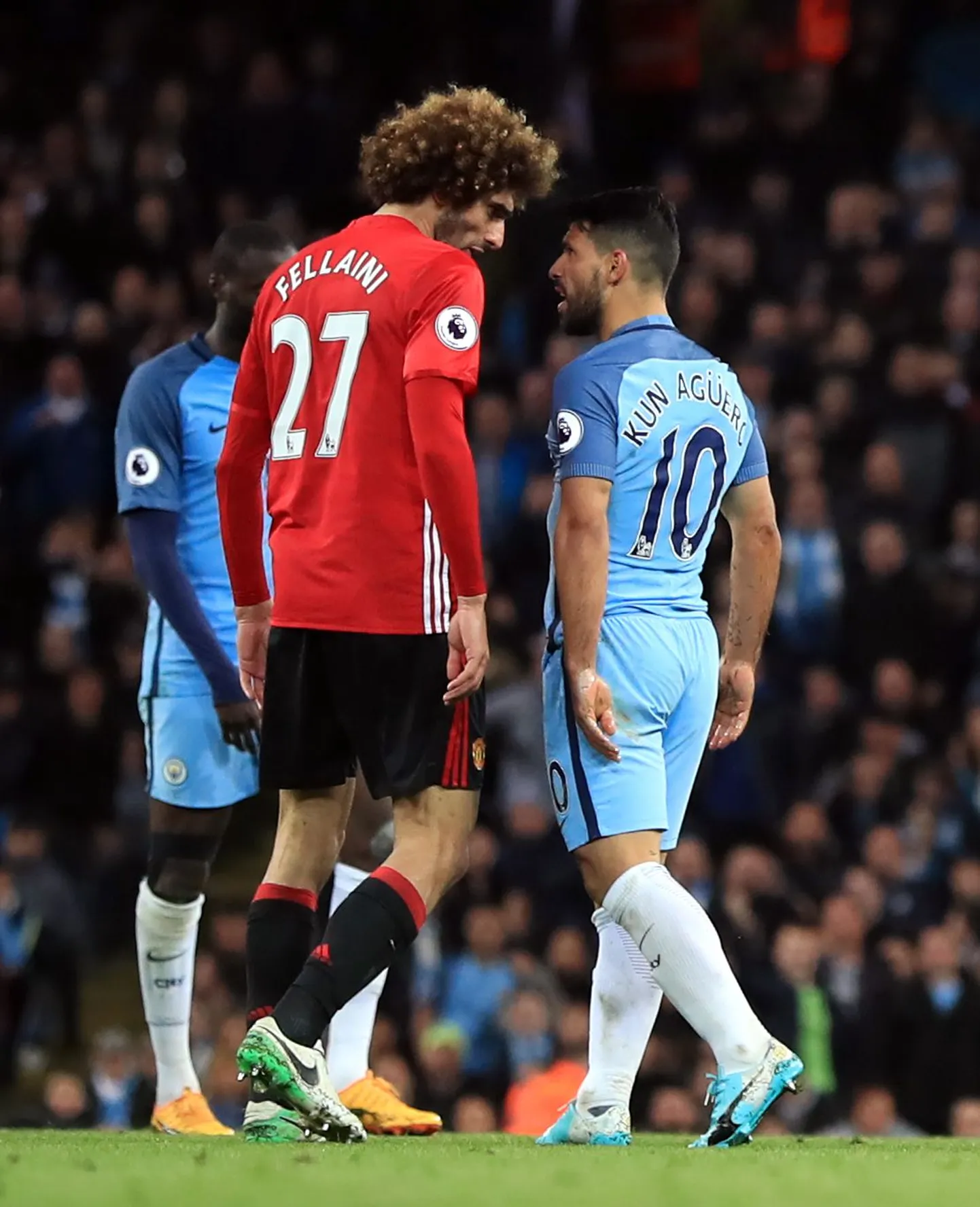 Marouane Fellaini ja Sergio Agüero