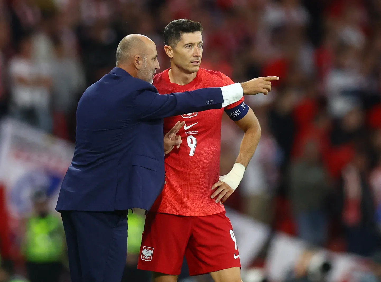 Futbola treneris Mihals Proberžs un uzbrucējs Roberts Levandovskis