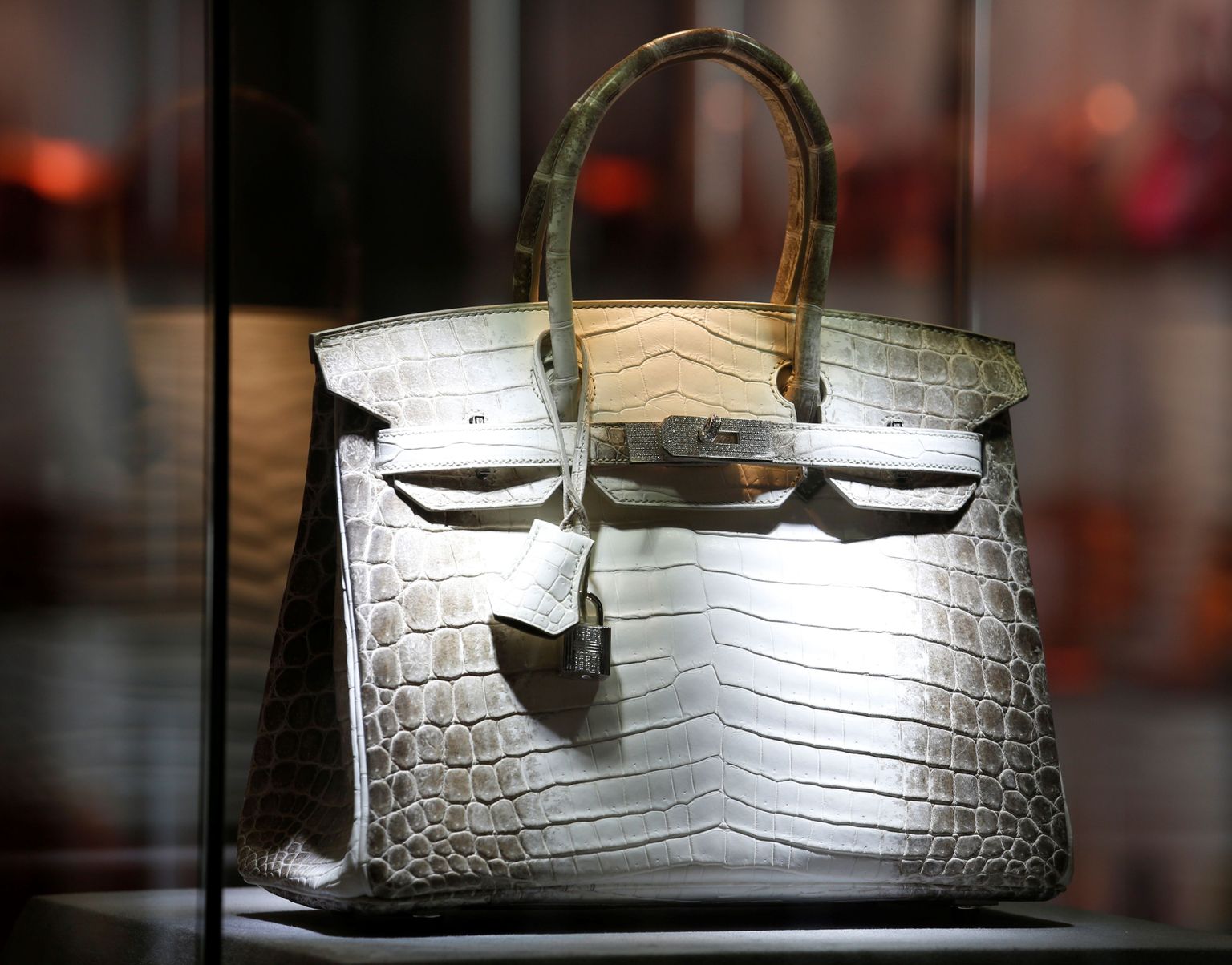 A matte white Himalaya niloticus crocodile Birkin 30 with 18k white gold and diamond hardware by Hermes, is seen during Christie's Autumn sales preview in Hong Kong, China November 23, 2016.      REUTERS/Bobby Yip          FOR EDITORIAL USE ONLY. NO RESALES. NO ARCHIVES.