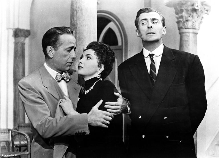 Kaader filmist «Beat the Devil», pildil Humphrey Bogart, Gina Lollobrigida ja Edward Underdown