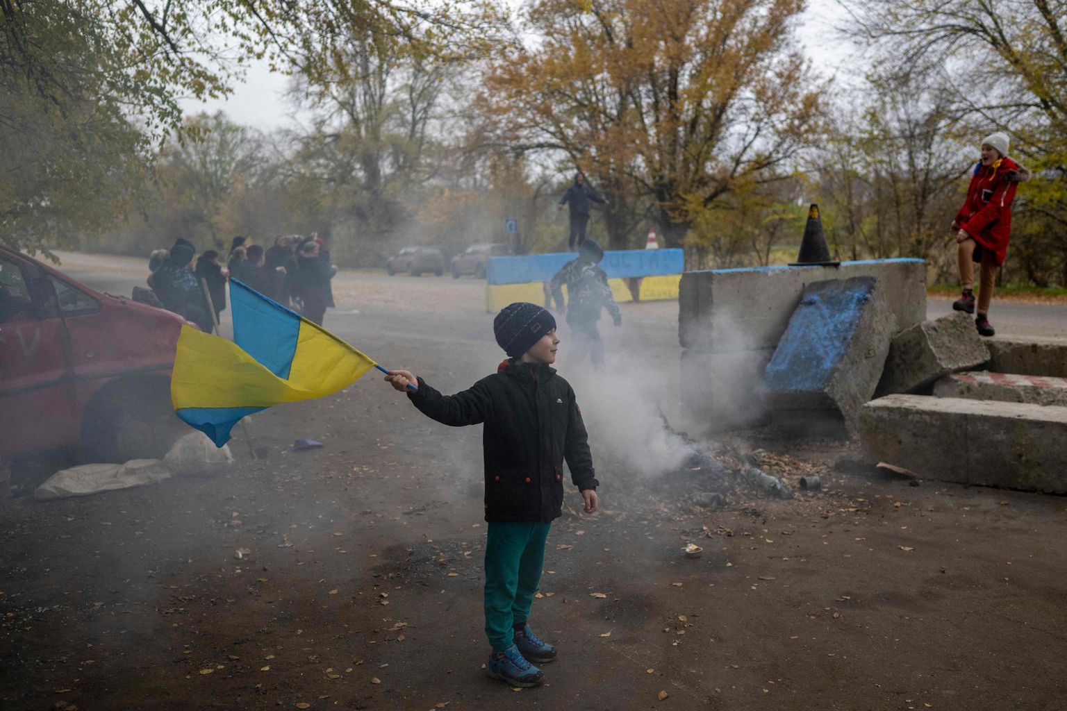 Puisēns ar Ukrainas karogu pēc Hersonas atbrīvošanas.