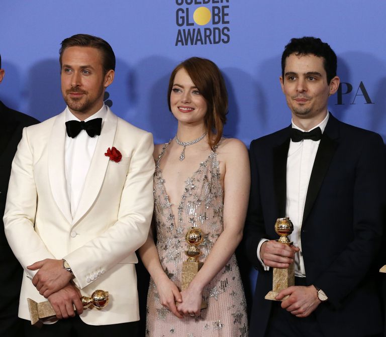 Ryan Gosling, Emma Stone ja Damian Chazelle Kuldgloobuste galal. REUTERS/Mario Anzuoni