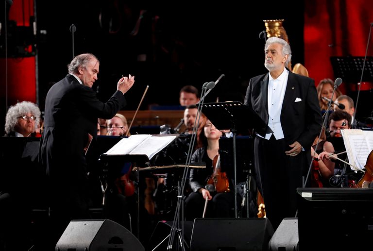 FILE PHOTO: Russian conductor Valery Gergiev (L) and Spanish tenor Placido Domingo perform during a gala concert, dedicated to the upcoming World Cup, in Red Square in Moscow, Russia, June 13, 2018. Sergei Chirikov/Pool via REUTERS/File Photo