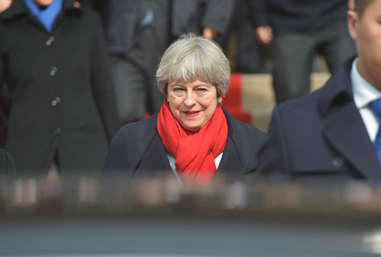 British Prime Minister Theresa May (C) attends an event in Wuhan in China's central Hubei province on January 31, 2018. 
British Prime Minister Theresa May began a visit to China on January 31, as she tries to strengthen her country's global trade links before its contentious divorce with the European Union. / AFP PHOTO / - / China OUT