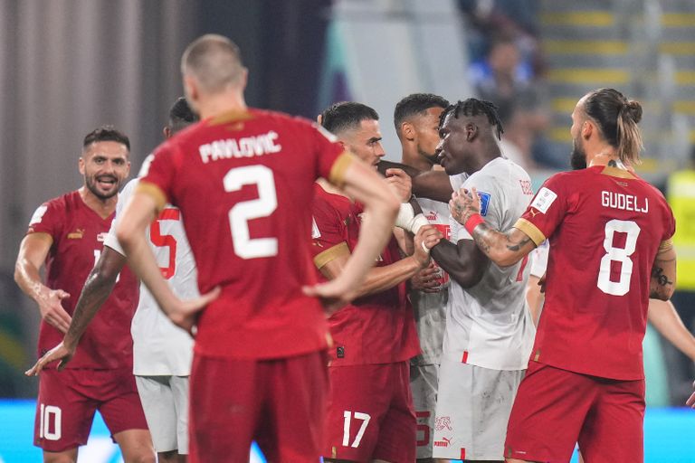 Serbia's Filip Kostic, center, argues with Switzerland's Breel Embolo second right, during the World Cup group G soccer match between Serbia and Switzerland, at the Stadium 974 in Doha, Qatar, Friday, Dec. 2, 2022. (AP Photo/Petr David Josek) MF146