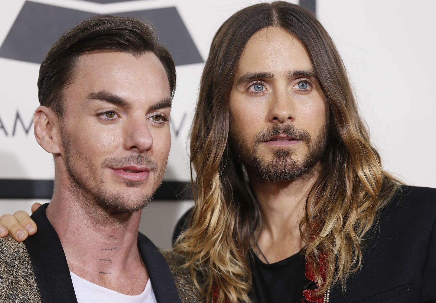 Rock band Thirty Seconds to Mars members Shannon Leto and Jared Leto (L-R) arrive at the 56th annual Grammy Awards in Los Angeles, California January 26, 2014.     REUTERS/Danny Moloshok (UNITED STATES TAGS: ENTERTAINMENT) (GRAMMYS-ARRIVALS)