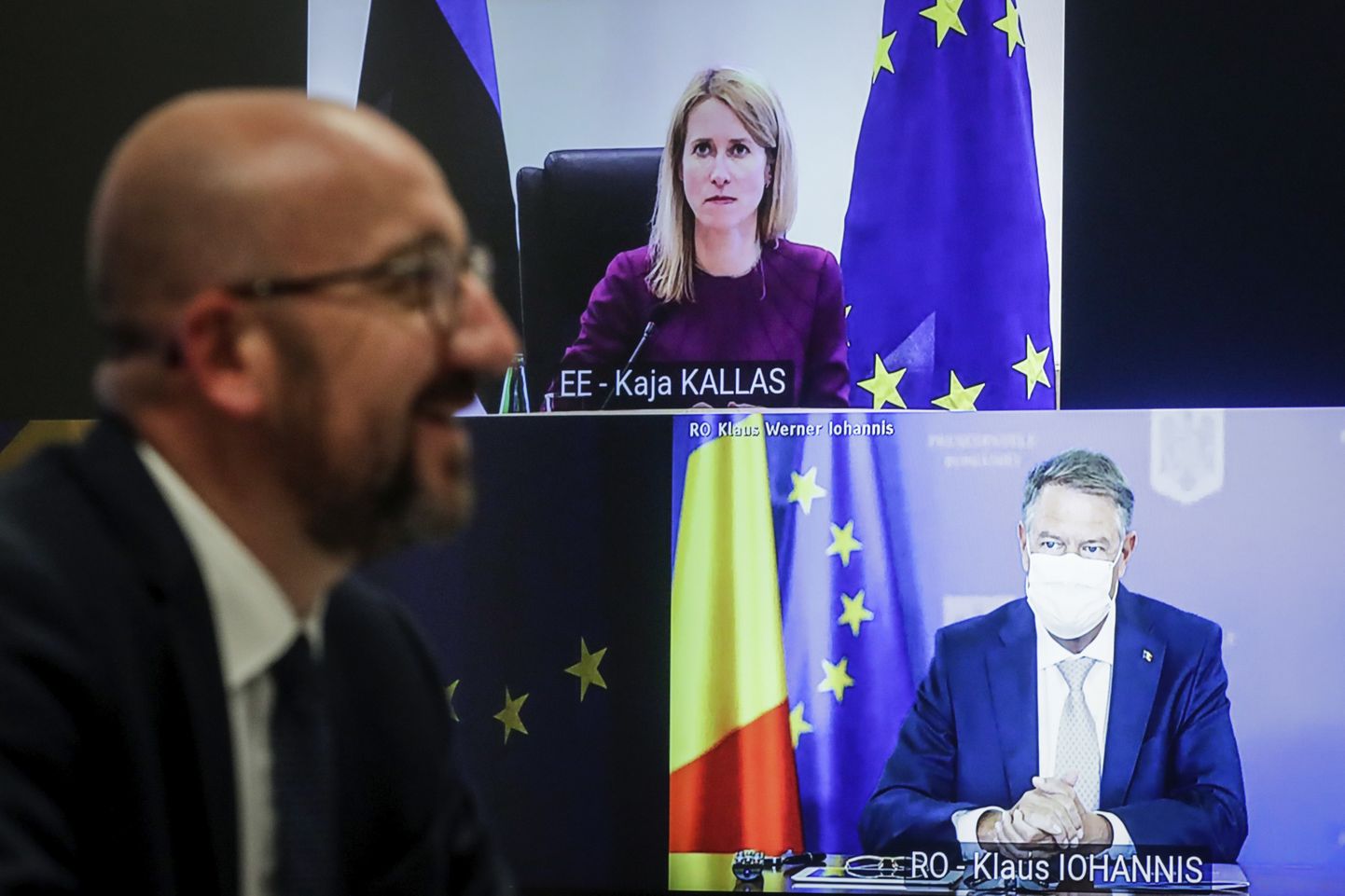 European Council President Charles Michel, left, speaks Estonia's Prime Minister Kaja Kallas and Romania's President Klaus Werner Ioannis during a meeting via video link at the European Council building in Brussels, Wednesday, May 19, 2021. European Council President Charles Michel is meeting with EU leaders via video link to prepare for an upcoming EU summit which begins on Monday. (Stephanie Lecocq, Pool via AP)