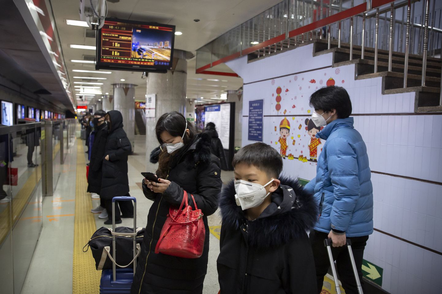 Ķīnas iedzīvotāji ar sejas maskām