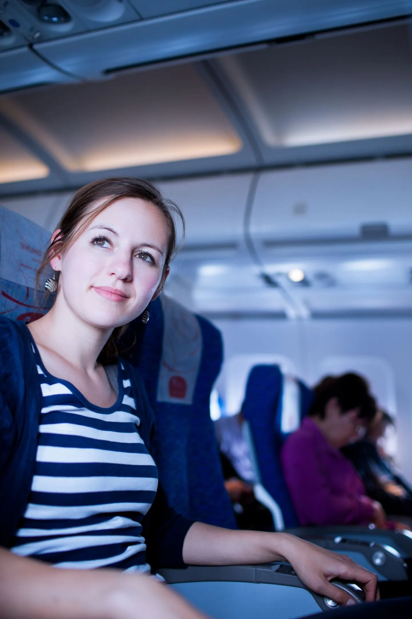 Пассажир в самолете. Фото иллюстративное