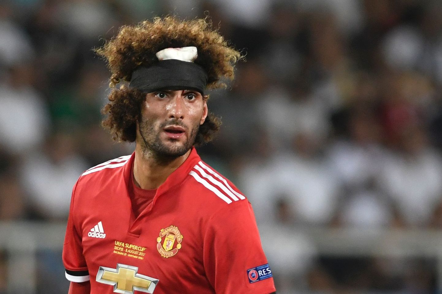Manchester United's Belgian midfielder Marouane Fellaini looks on during the UEFA Super Cup football match between Real Madrid and Manchester United on August 8, 2017, at the Philip II Arena in Skopje. / AFP PHOTO / Nikolay DOYCHINOV