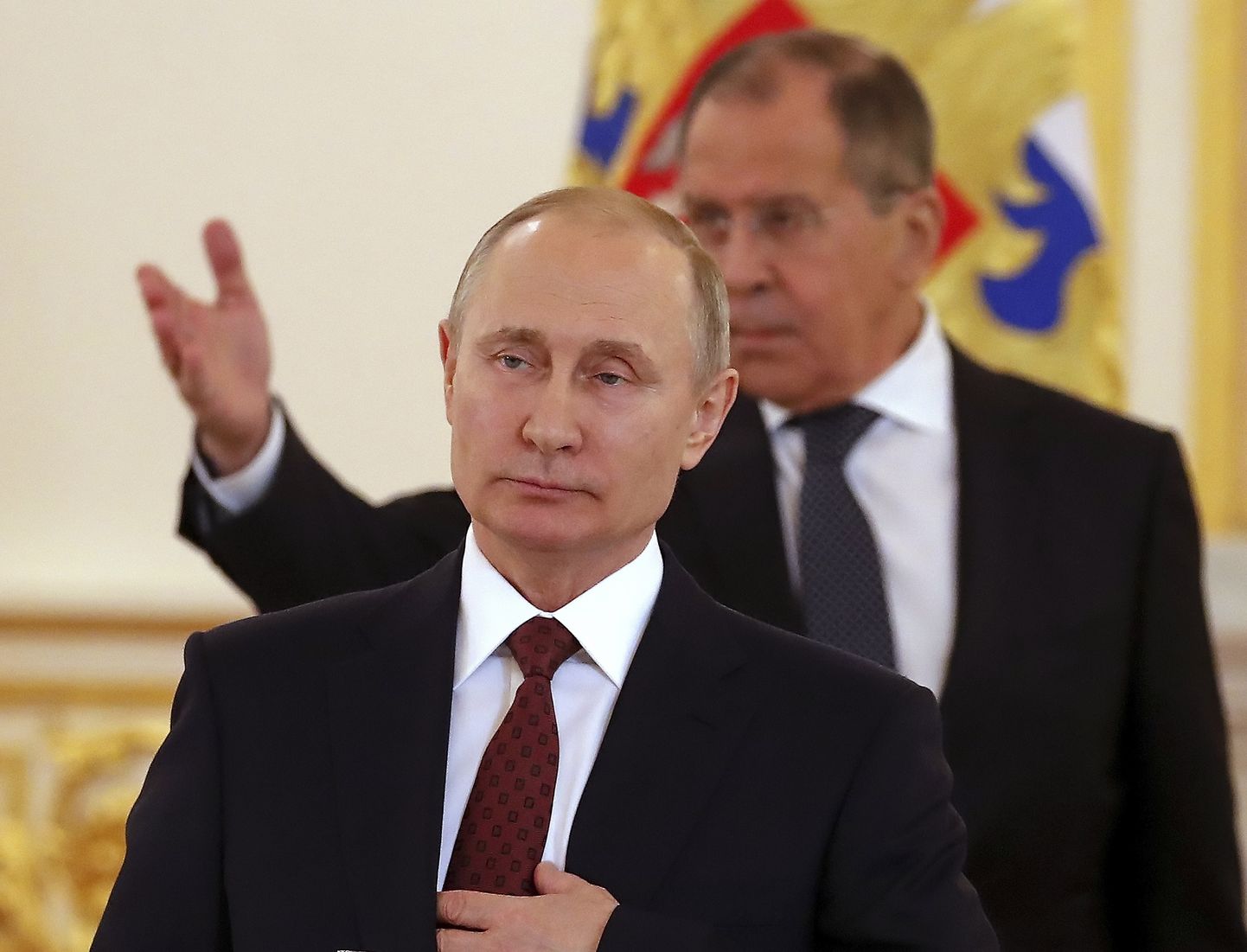 Venemaa president Vladimir Putin, taustal Sergei Lavrov.