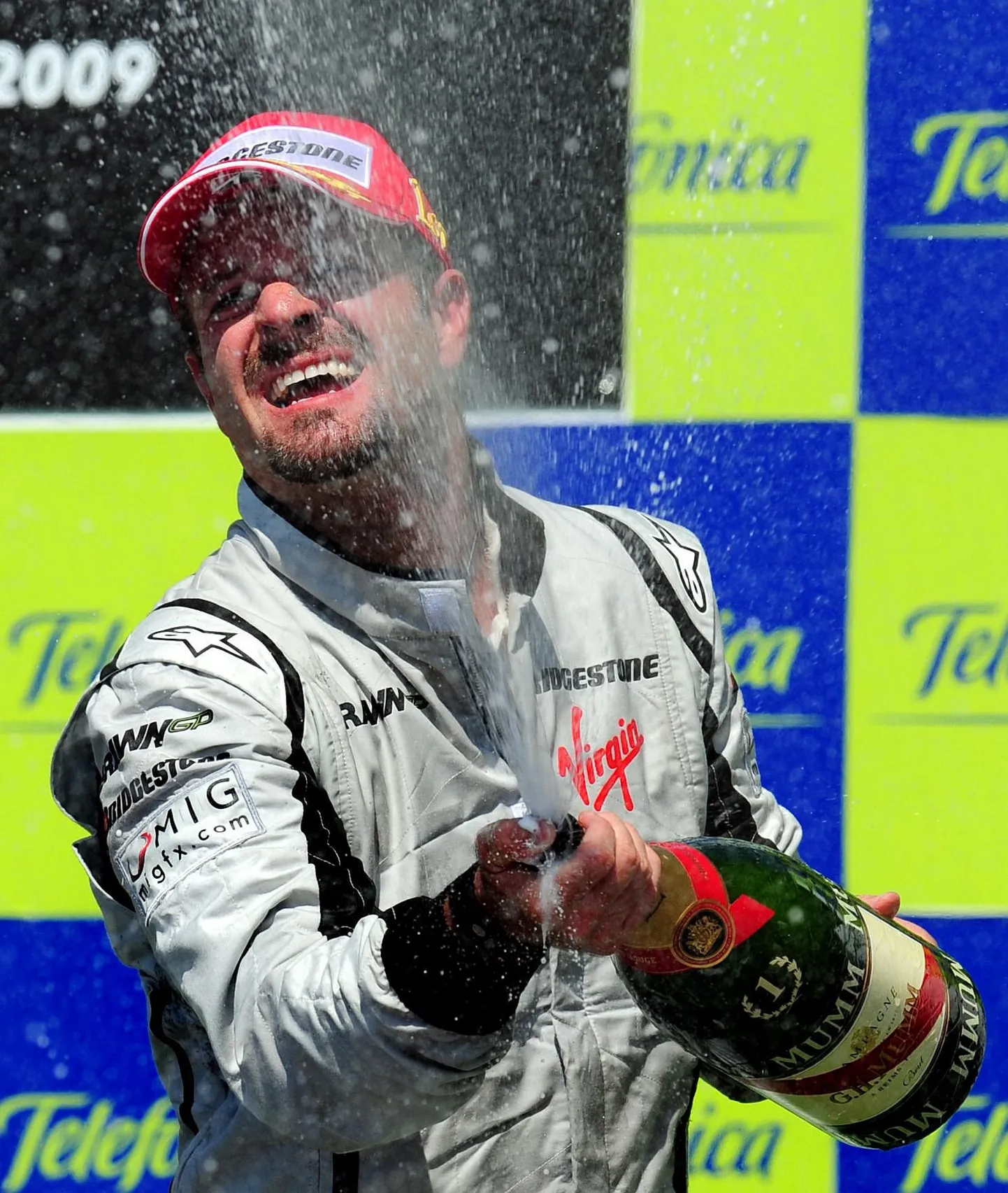 Rubens Barrichello poodiumil.