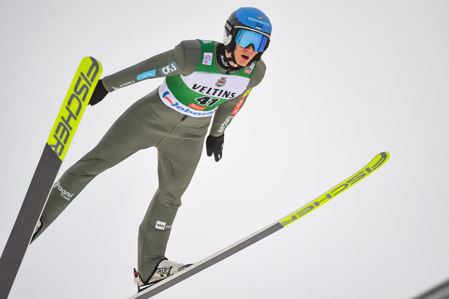 epa09604432 Kristjan Ilves of Estonia in action during the Men's Individual Gundersen 5 km large hill portion of the FIS Nordic Combined World Cup in Ruka, Finland, 26 November 2021.  EPA/KIMMO BRANDT
