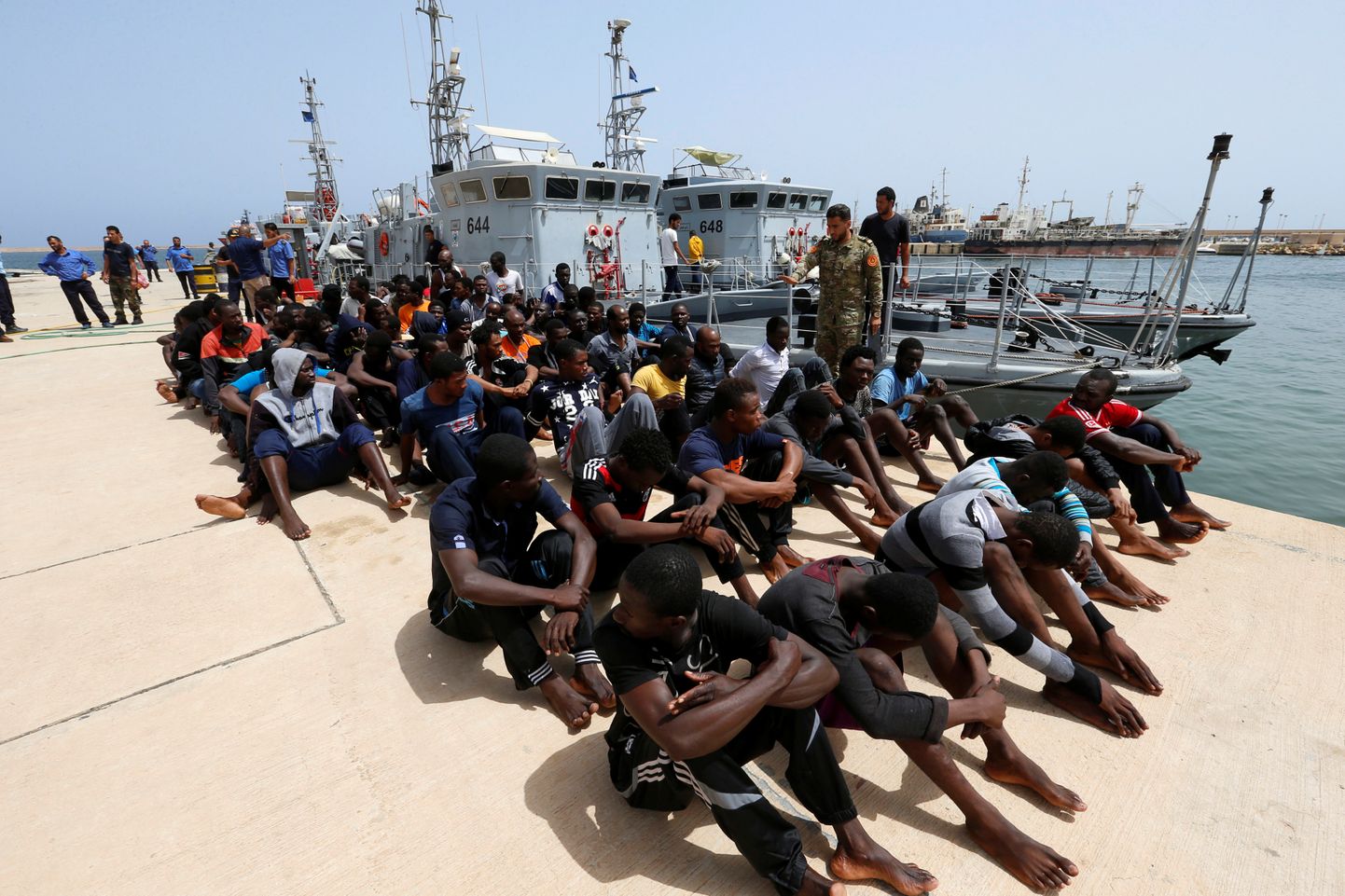 Migrandid Tripoli sadamas.