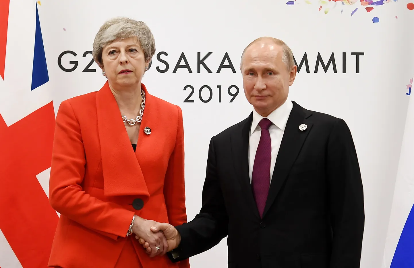 Lielbritānijas premjerministre Terēza Meja un Krievijas prezidents Vladimirs Putins G20 samitā Japānā.