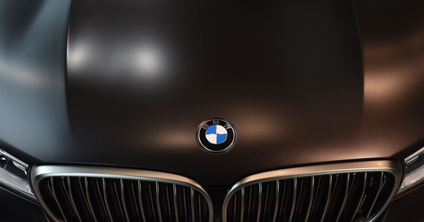 The logo of the German car maker BMW is seen on a car prior to the company's annual press conference in Munich, southern Germany, on March 21, 2017. / AFP PHOTO / Christof STACHE