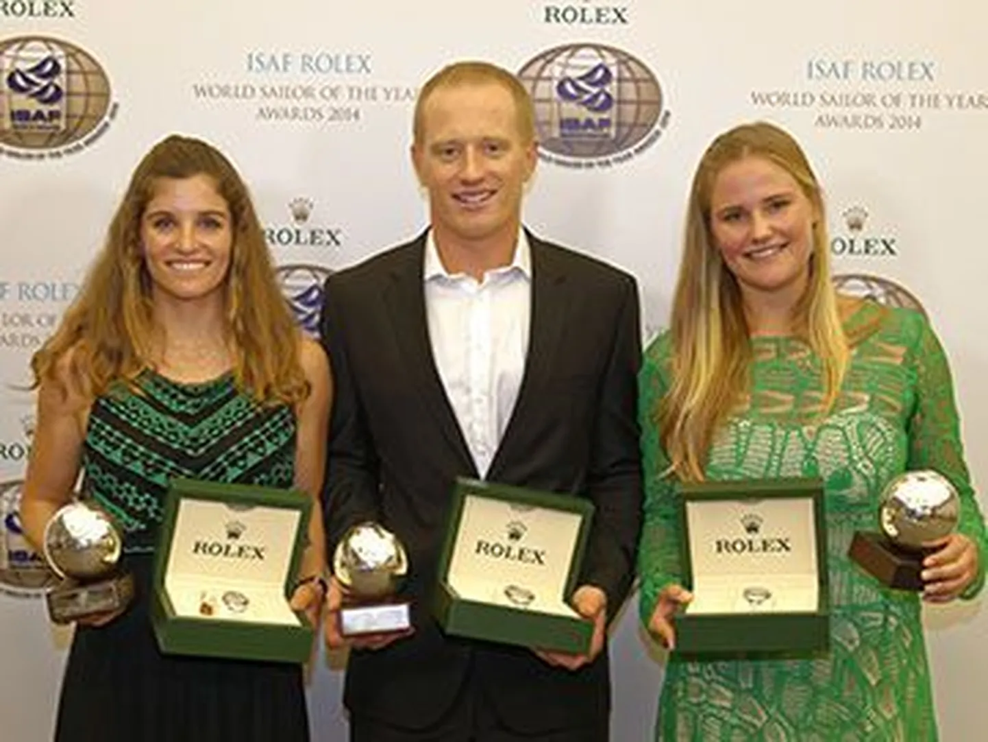 Aasta parimateks purjetajateks valitud Martine Grael ja Kahena Kunze ja James Spithill.