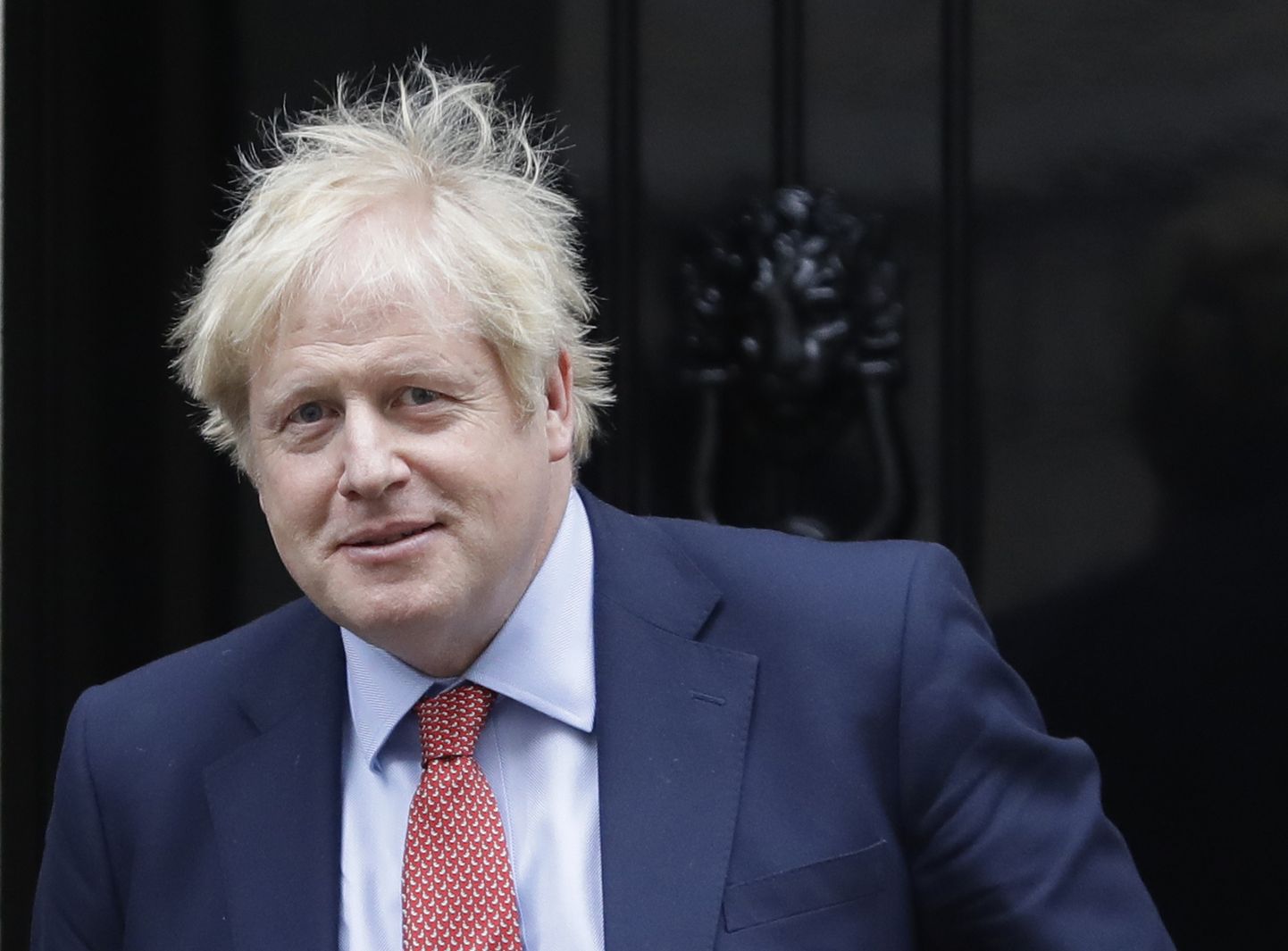 Britain's Prime Minister Boris Johnson leaves 10 Downing Street to attend the weekly session of Prime Minister's Questions in Parliament in London, Wednesday, Jan. 22, 2020. (AP Photo/Kirsty Wigglesworth)