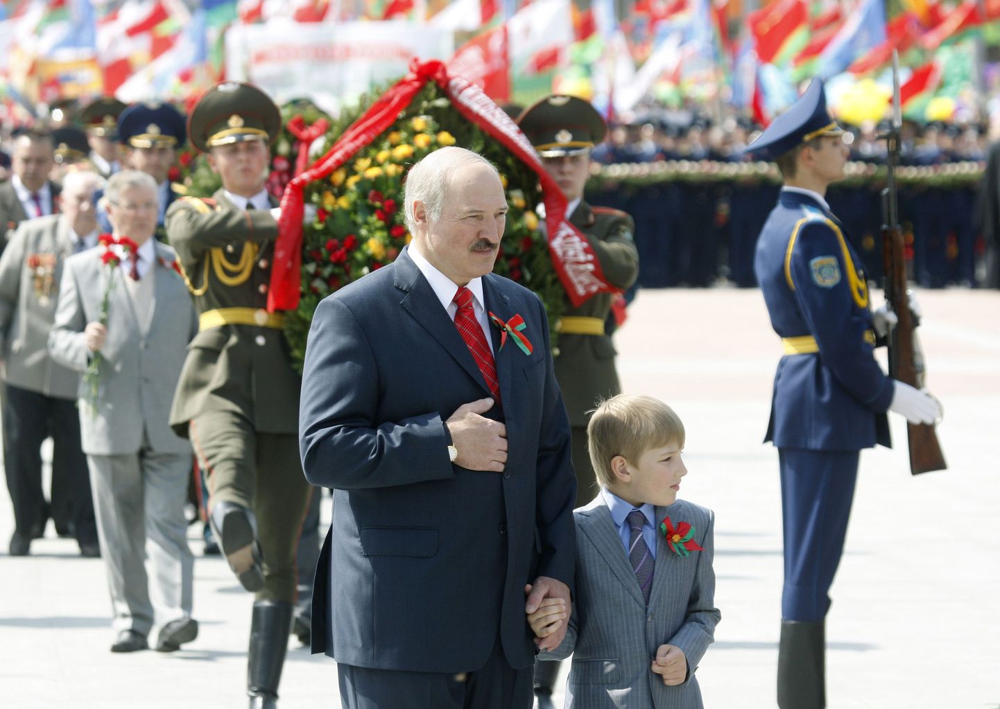 Belarus' President Alexander Lukashenko with his son Nikolay take part in a wreath laying ceremony at Victory square in Minsk May 9, 2011. Belarus celebrated the 66th anniversary of the World War Two victory over Nazi Germany on Monday.  REUTERS/Vasily Fedosenko (BELARUS - Tags: ANNIVERSARY CIVIL UNREST POLITICS)