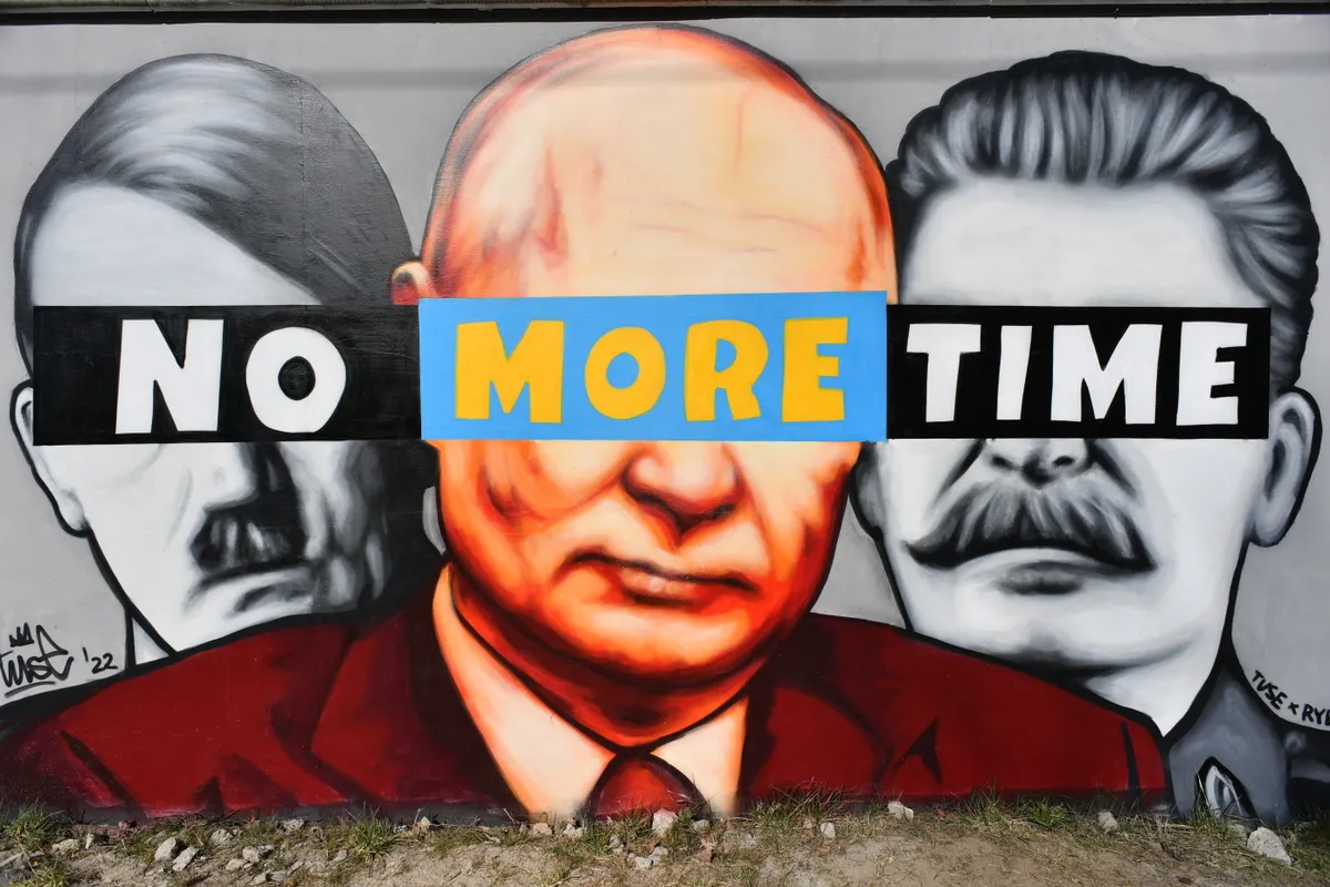 A mural showing Hitler, Putin and Stalin 'No more time' created by graffiti artist Tuse, is sprayed on a wall n Gdansk, northern Poland