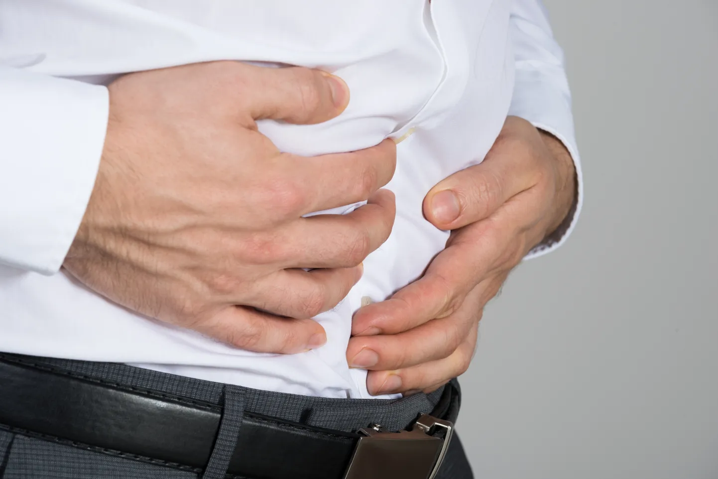 Businessman Suffering From Stomach Ache