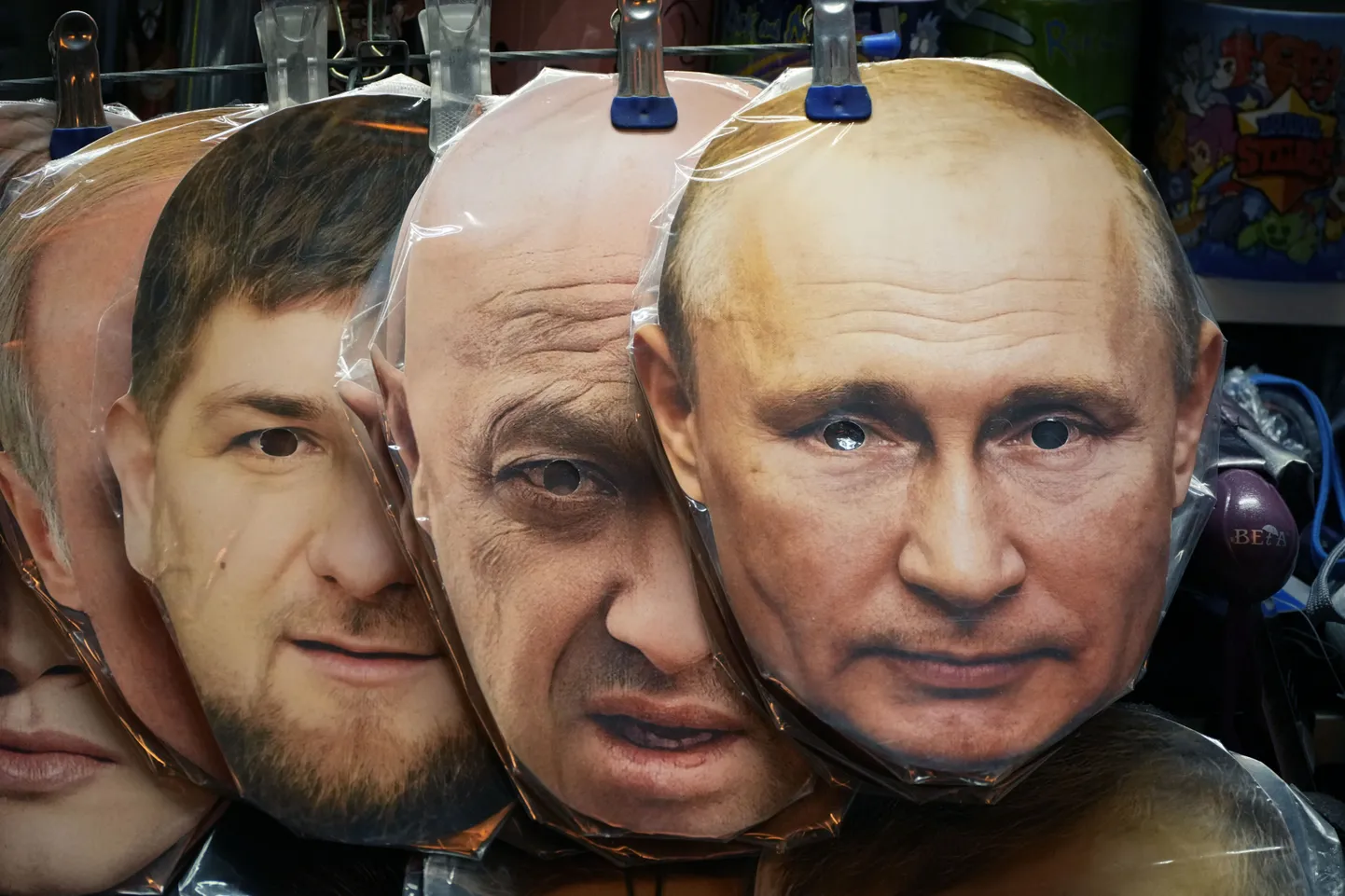 Face masks depicting Russian President Vladimir Putin, right, owner of private military company Wagner Group Yevgeny Prigozhin, centre, and Chechnya's regional leader Ramzan Kadyrov, left, are displayed among others for sale at a souvenir shop in St. Petersburg, Russia, Sunday, June 4, 2023. (AP Photo/Dmitri Lovetsky)  XDL101