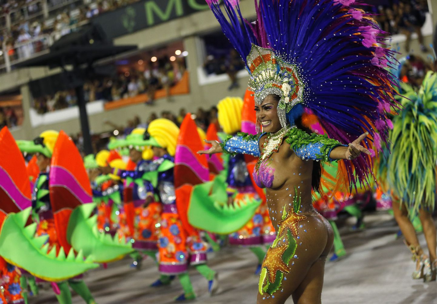 A performer from the Uniao da Ilha samba school dances during Carnival celebrations at the Sambadrome in Rio de Janeiro, Brazil, Sunday, Feb. 7, 2016. (AP Photo/Silvia Izquierdo)