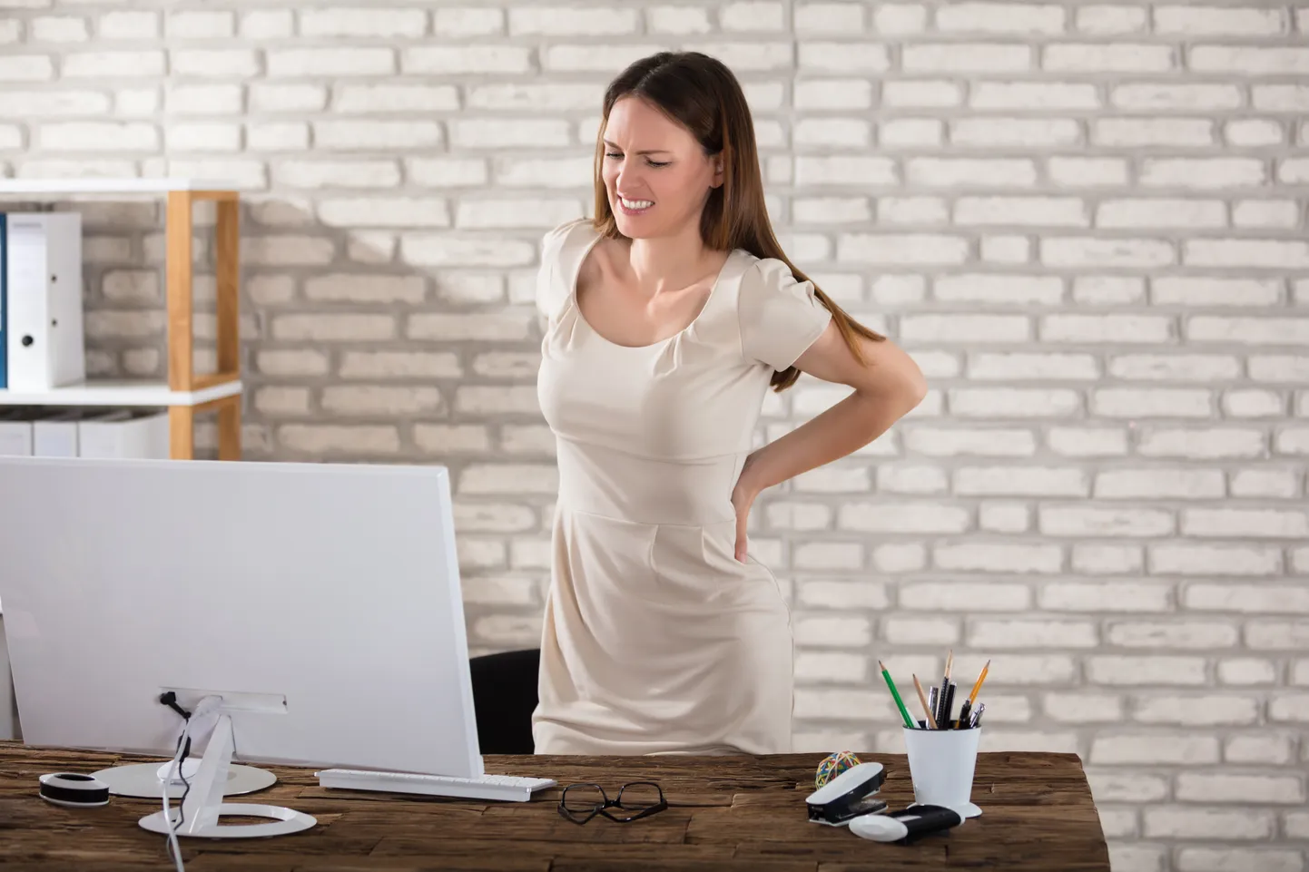 Businesswoman Suffering From Back Pain
