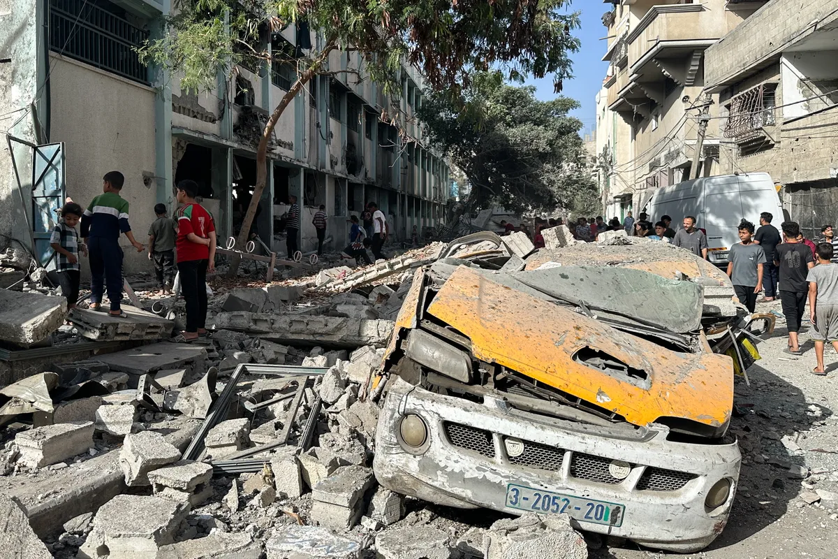 MAY 26, 2025, Gaza City, Gaza Strip, Palestinian Territories: Local residents are seen inspecting the damage after an Israeli air strike on the Fahmi Al-Jarjawi School in Gaza City.