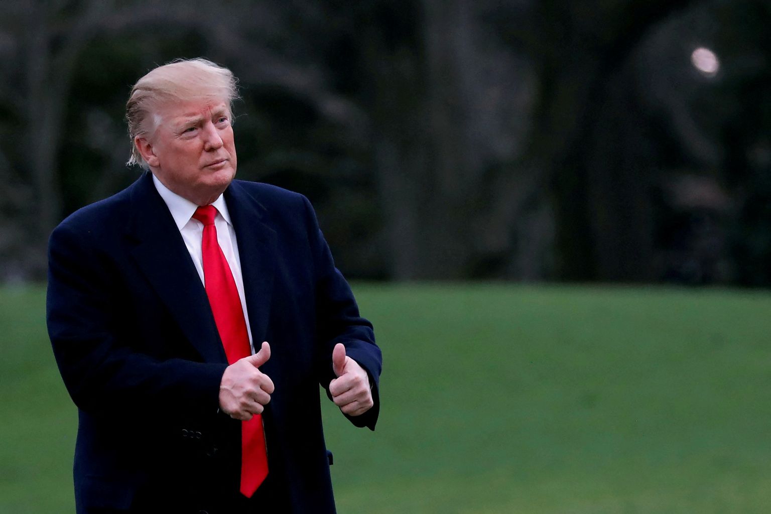 FILE PHOTO: U.S. President Donald Trump reacts as he returns to the White House after U.S. Attorney General William Barr reported to congressional leaders on the submission of the report of Special Counsel Robert Mueller in Washington, U.S., March 24, 2019. REUTERS/Carlos Barria/File Photo