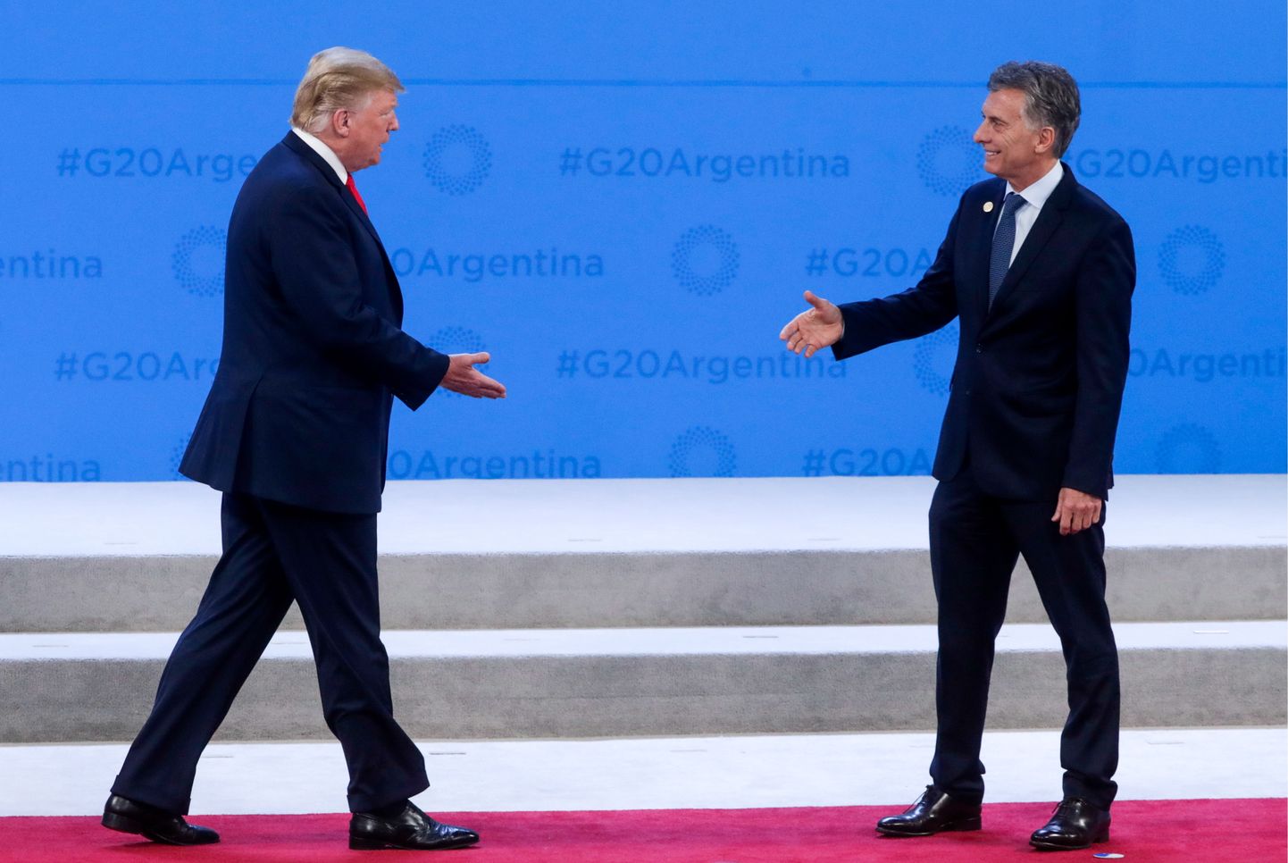Mauricio Macri (paremal) tervitamas Donald Trumpi.