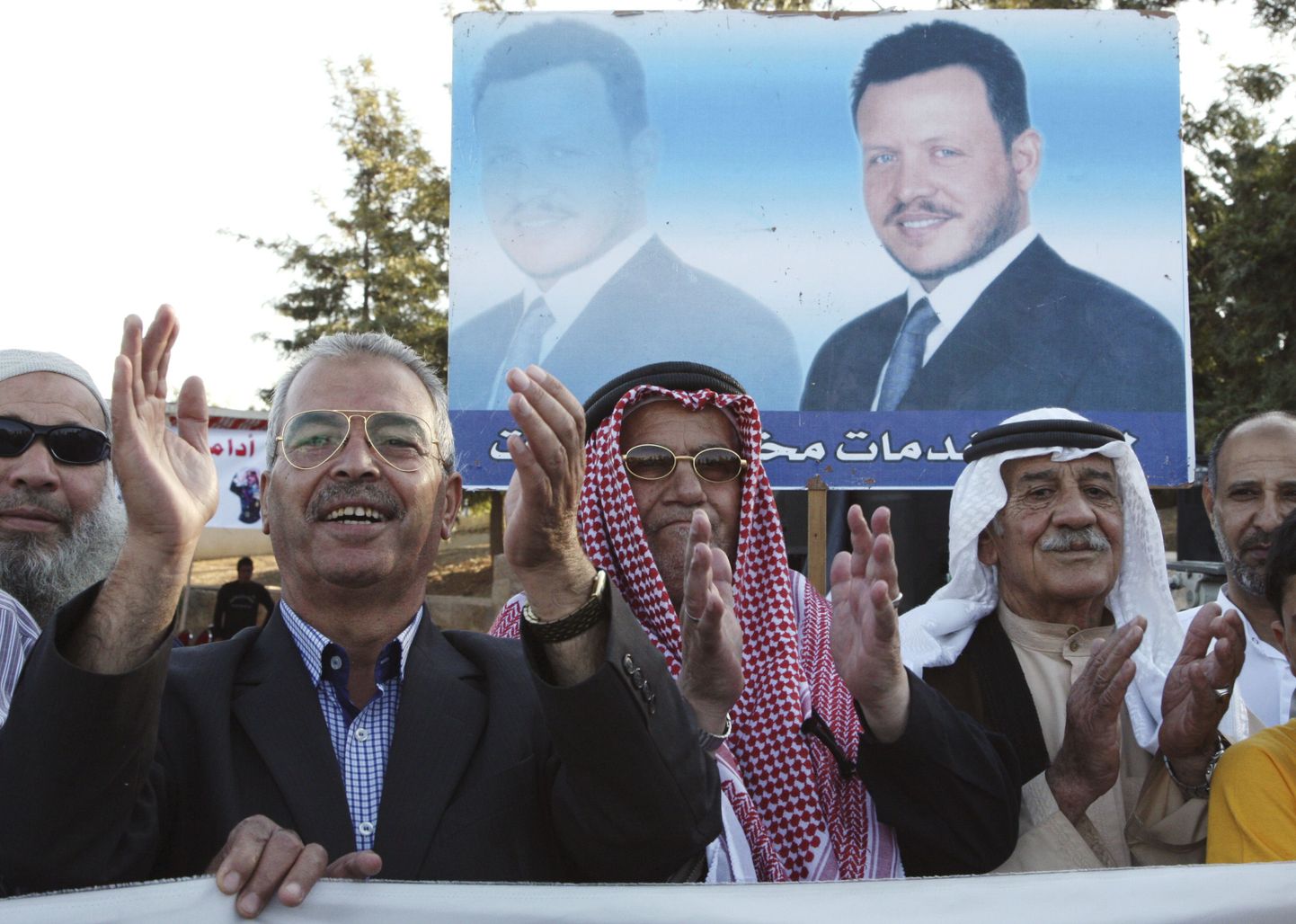 Jordaania kuningas Abdullah II poolehoidjad eile pealinnas Ammanis aset leidnud demonstratsioonil. Taga paistab kuninga pilt.
