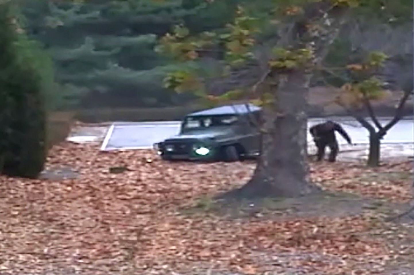 TOPSHOT - This screengrab made from video footage released by the United Nations Command on November 22, 2017 shows a North Korea defector running out from a vehicle at the Joint Security Area of the Demilitarized Zone (DMZ).
Dramatic footage of a North Korean soldier's defection released on November 22 showed him racing across the border under fire from former comrades, and then being hauled to safety by South Korean troops. The defector, who ran across the border at the Panmunjom truce village on November 13, was shot at least four times and has been recovering in a South Korean hospital. / AFP PHOTO / UNITED NATIONS COMMAND / Handout / RESTRICTED TO EDITORIAL USE - MANDATORY CREDIT "AFP PHOTO / UNITED NATIONS COMMAND (UNC)" - NO MARKETING NO ADVERTISING CAMPAIGNS - DISTRIBUTED AS A SERVICE TO CLIENTS