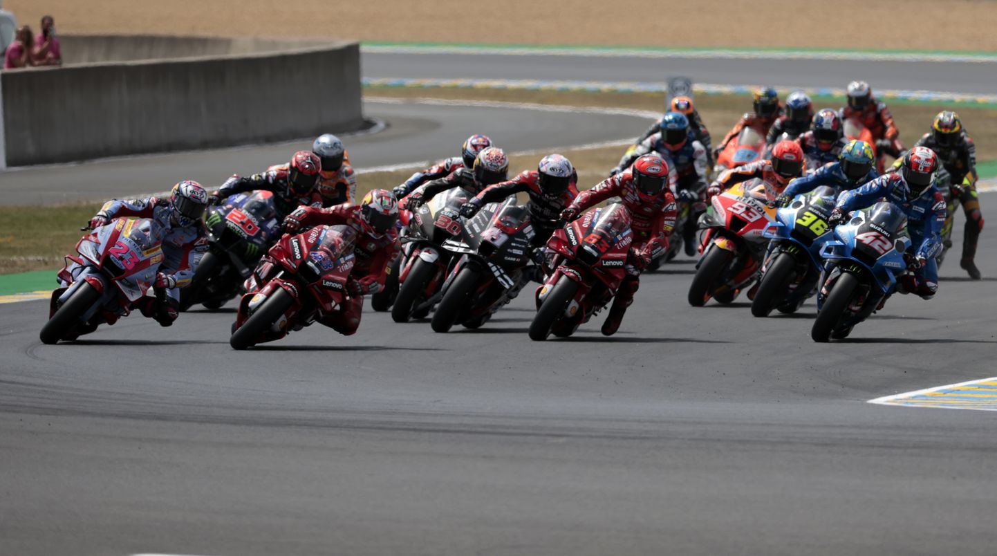Australian rider Jack Miller of the Ducati Lenovo Team leads the pack at the start of the MotoGP race of the French Motorcycle Grand Prix at the Le Mans racetrack, in Le Mans, France, Sunday, May 15, 2022. (AP Photo/Jeremias Gonzalez)
