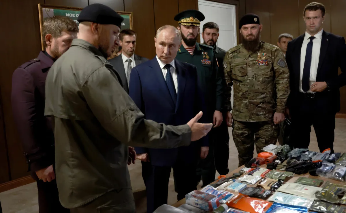 August 20, 2024, Gudermes, Chechen Republic, Russia: Russian President Vladimir Putin, center, views a display of foreign weapons captured in Ukraine, during a visit to the Russian Special Forces School, August 20, 2024 in Gudermes, Chechen Republic, Russia. The surprise visit by Putin is his first to the region since 2011.