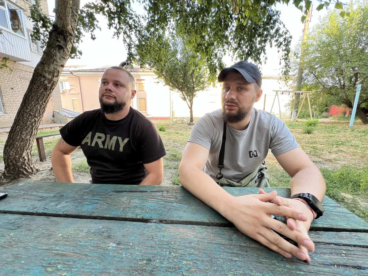 Captain of the 3rd Assault Brigade, Salidol (left), and a battalion Chief of Staff, Doc, giving an interview to us in a frontline town in eastern Ukraine.